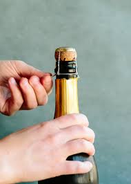 Remove the foil and wire cage—hold the bottle firmly at the bottom, loosen the wire cage. How To Open A Bottle Of Champagne Kitchn