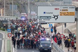 Spain installs floating barrier in Ceuta after deadly migrant rush | Reuters
