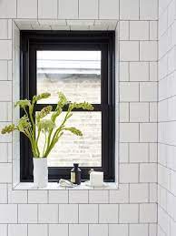 Wood framed window next to tub with. Photo Gallery 11 Inspiring Bathroom Makeovers Window In Shower Black Window Frames Bathroom Windows