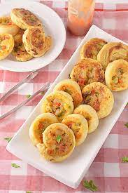 All you have to do is pop them into a hot oven! Veggie Pinwheels Party Appetizer Party Potluck Recipes Finger Foods