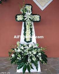 Flower arrangements for children's memorials aren't quite as traditional as conventional arrangements, and are usually focused on the a: Elegant Cross Arrangement Stand Kindly Specifly Preferred Colour If Not As Shown Funeral Flower Arrangements Funeral Flowers Online Florist