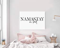 Upgrade your cozy escapes with these modern bedroom ideas. Timprint Namastay In Bed Wall Art Namaste In Bed Print Bedroom Decor Bedroom Yoga Decor Bedroom Above Bed Decor Modern Wall Art Framed Print Wall Art Buy Online In Bahamas At Bahamas Desertcart Com