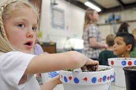 MCHS students assist elementary school with gardening project