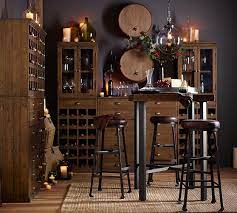 Tabletop is crafted from reclaimed chinese pine. Griffin Reclaimed Wood Bar Height Table Pottery Barn