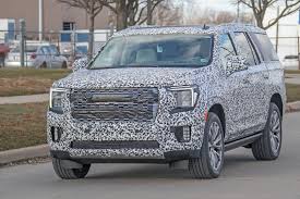 Blingy 2021 Gmc Yukon Denali Shows Sierra Inspired Face As The Camo Thins Out Carscoops