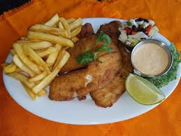 Friday Special Cuban Fish And Chips Sazon Dusted White Fish Lightly Fried With French Fries Or Plantain Chips And In House Cuban Recipes Food Food Culture