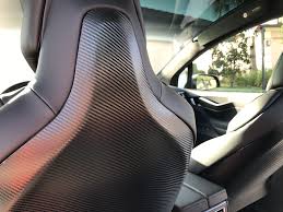 Black And Gold Carbon Fiber Wrap Tesla Model X Black Satin Gold Dust Vinyl Wrap With Carbon Fiber Accents On Chrome And All 6 Seat Backs Awesome Post Tesla Model X Tesla Model Carbon Fiber