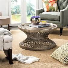 Find the perfect home furnishings at hayneedle, where you can buy online while you explore our room designs and curated looks for tips, ideas & inspiration to help you along the way. Safavieh Grimson Large Bowed Brown Wicker Coffee Table 31 5 In Diameter Wik6507b Rona