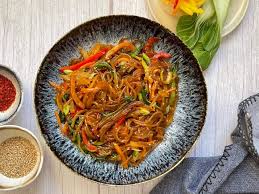 Soak japchae in hot water first. Vegetarian Japchae Korean Stir Fried Glass Noodles Naturally Nidhi
