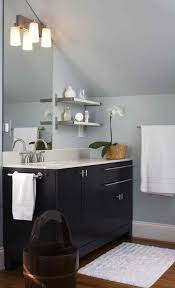 Hooks that can hold napkins and towels are also great additions. 13 Ideas For Decorating With A Sloped Ceiling Mabey She Made It Sloped Ceiling Sloped Ceiling Bedroom Slanted Walls