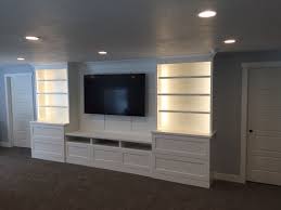 White Shaker Entertainment Center With Batten Board Tv Panel And Book Case Lights Built In Entertainment Center Entertainment Center Home