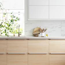 Change the color of both wood veneer and laminate cabinets by painting them. 12 Ways To Revamp Kitchens For Less Than 50 From Painting To Hanging Blinds