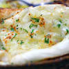 Transfer the flatbread to a plate and repeat to cook the second flatbread. 1