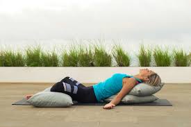 Begin sitting on the floor, legs extended. Reclining Butterfly Pose Yoga 15