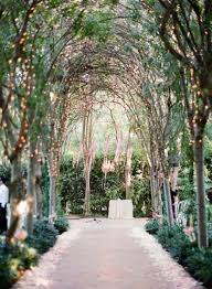 Unconventional Wedding Ideas Garden Wedding Ceremony Twinkle Lights And A Floral Chande Romantic Garden Wedding Whimsical Wedding Decorations Outdoor Wedding