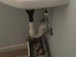 Why don't you hide them under a sink skirt? How To Hide These Ugly Plumbing Pipes