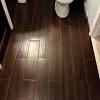 The polished glazed ceramic hardwood tiles will give your space a glossy timeless look. 1