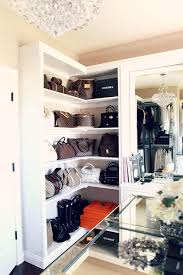 How to store purses to keep them in good condition. Designer Bags Sit Against A Beige Wall Atop Built In White Wrap Around Shelves Positioned Beside A Dresser Vanity Accen Bag Closet Closet Designs Closet Design
