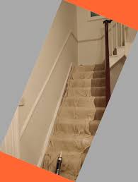 I'm guessing the chair rail is on a wall that is on the open (balustrade?) side of the stairs, and it is running into the nosing that returns around the side of the stair tread. Fitting Dado Rail On Stairs