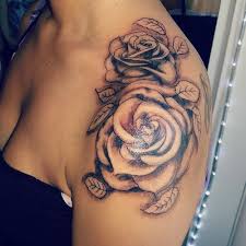 Blood appears to drip off this tattoo of a rose on a man's shoulder, running down the leaves onto his arm. 13 Awesome Rose Shoulder Tattoo Ideas With Meanings Body Tattoo Art