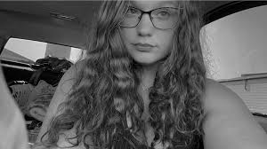 Woman in white van asking for money at Meijer