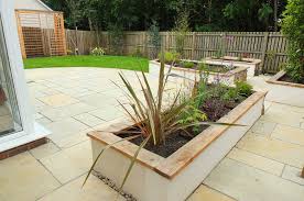 Using cinderblocks is another great solution for a raised garden bed and is very cost effective as well. Kirkliston Contemporary Natural New Build Garden Design Stone Wood Water Light
