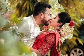 Image May Contain One Or More People Flower Wedding And Outd Indian Wedding Photography Couples Wedding Couples Photography Wedding Couple Poses Photography