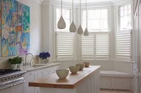Custom paint plantation shutters with 2 1/2 slats. Bay Window Shutters Effective Sun And Privacy Protection Ideas