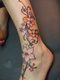 This tattoo has a striking message that needs no interpretation in it because of the text already present there. Beautiful Flower Tattoo On Leg Ankle Tattoo Designs Leg Tattoos Women Leg Tattoos