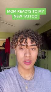 Jaden Cross Neck Tattoo