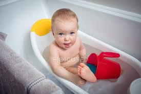 See baby bathtub stock video clips. Baby Girl Taking Bath In Bathtub At Bathroom Authentic People Stock Photo 209292554