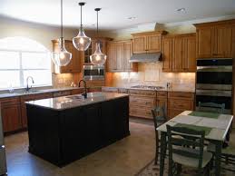 Breeze By Woodharborcc Perimeter Features Asbury Door Style With Allspice Chocolate Glaze Finish On Knotty Alder Island Feat Custom Cabinetry Interior Design