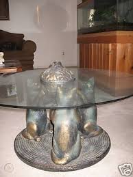 Traditional and unique coffee tables. Cat Table Glass Table Held By Three Cat Statues 42563241