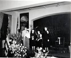 A B & W photograph of four young adults and Mrs. Commissioner Edith Bates. 