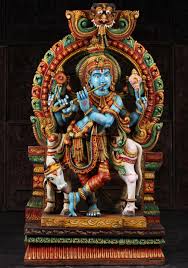 A spectacular floral arrangement leads up to the statue. Wooden Blue Krishna Playing Flute With Cow 70 98w17 Hindu Gods Buddha Statues