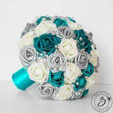 Plateau state, jos, jun 10. Teal Y Glamorous Teal Silver And White Wedding Bouquet With Crystals And Pearls Beautiful Wedding Colo Teal Wedding Bouquet Teal Wedding Colors Teal Wedding