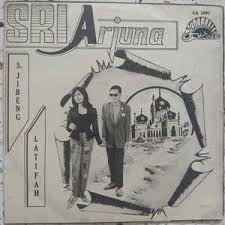 Gema takbir di subuh hari menjelang sudah aidil fitri tapi hamba musafir diri ke sana sini membawa diri. Sri Arjuna S Jibeng Latifah Musafir Di Aidilfitri 1967 Vinyl Discogs