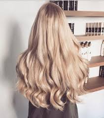 This modern hairstyle involves the bun as an addition, but really, the beauty of it is the long hair. Long Blonde Hair Images On Favim Com