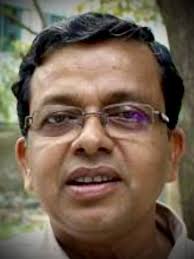 He is Ambikesh Mahapatra, a brilliant scientist at Jadavpur. In 2012, he  shared a Mamata Banerjee cartoon. She didn't like it. He was thrashed by  TMC cadre and arrested the same day.