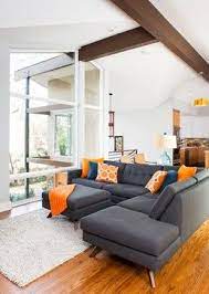 This living room is designed with contemporary decors and rectangular artworks mounted against. Mid Century Modern Mini Sectional Sofa Design Ideas Pictures Remodel And Dec Orange Living Room Inspiration Mid Century Modern Living Room Living Room Orange