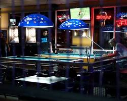 Image of Legends Pool & Sports Bar with people playing pool