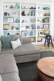 Since this type of shelving doesn't have visible hardware to coordinate with the rest of your space, you only have to focus on the base material and the decorative elements that sit on each one. 5 Living Room Accessories That Will Complete Your Home Decor Living Room Bookcase Shelf Decor Living Room Living Room Shelves
