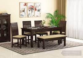 This extendable solid wood dining table has plenty of room to seat six in your dining room. Buy Adolph 6 Seater Dining Set With Bench Walnut Finish Online In India Wooden Street