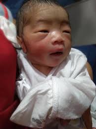 LOOK: One of the employees didn't hesitate to breastfeed an infant who was  left abandoned near a fast food store in Imus City, Cavite.