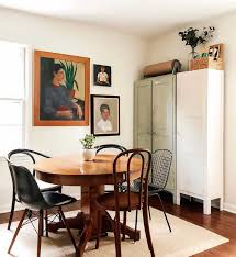 There's a square glass top dining table with a focused shot at this small eclectic dining space with a rectangular dining table set along with a. 15 Ideas You Ll Love For How To Hang Arrange Your Wall Art Eclectic Dining Room Dining Room Design Dining Room Small