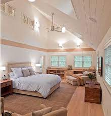 A scaled down edison bulb fits perfectly in a chic bedroom. Creative Ideas For High Ceilings Vaulted Ceiling Bedroom High Ceiling Bedroom Eclectic Bedroom