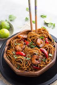 Add sugar snap peas and water chestnuts to the hot oil. Easy Shrimp Lo Mein Noodles