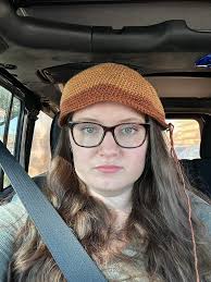 Crocheting micro hats for donation