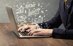 Sales Person In Suit Using A Laptop To Calculate Pie Chart And