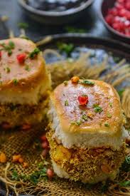 Kutchi Dabeli Is A Popular Indian Street Food And It S Basically Pav Stuffed With A Tangy And Spicy Potato Masala And Chutne Food Recipes Using Bananas Recipes